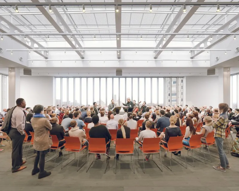 Rendering of people seated listening in a room.