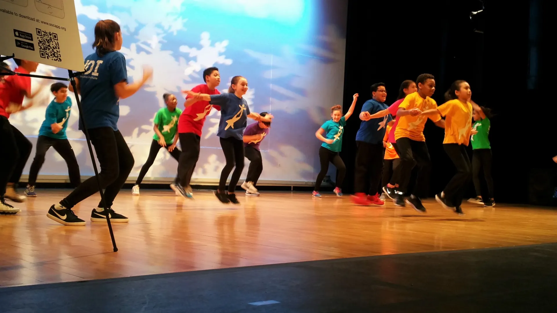 Students dance on stage at Miller Theater