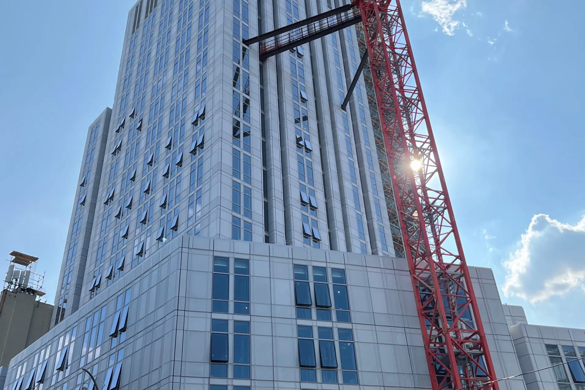 A view of the 600 W. 125th Street construction site which is 35 floors high, and has facade panels installed around it. 