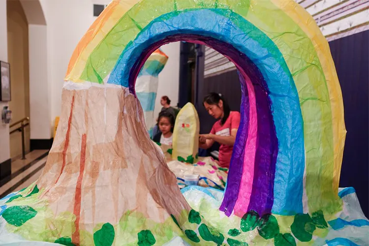 Lantern making in Miller Theatre with a volcano rainbow. 