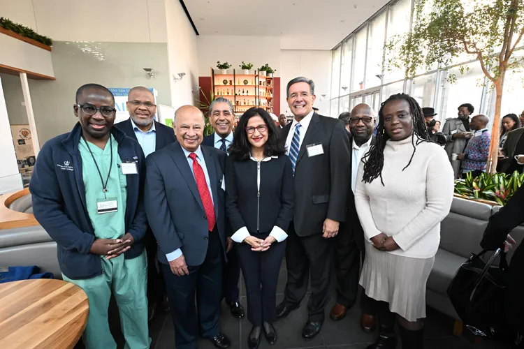 President Shafik stands with a group of community and state leaders at The Forum in Manhattanville. 