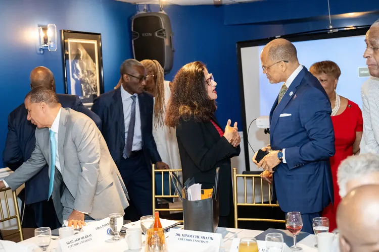 President Shafik with community leaders at a welcome breakfast hosted at Sylvia's restaurant.
