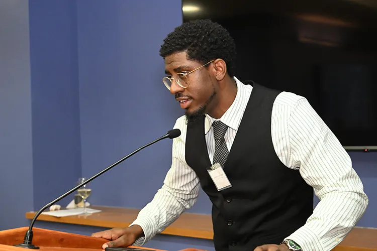A man talking to a group of people. 
