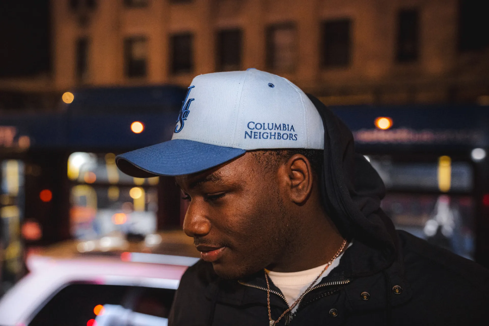 A parade attendee spots a "Just Make Sense" original Columbia Neighbors-embroidered baseball cap. We love to see it! Photo credit: Brandon Vallejo