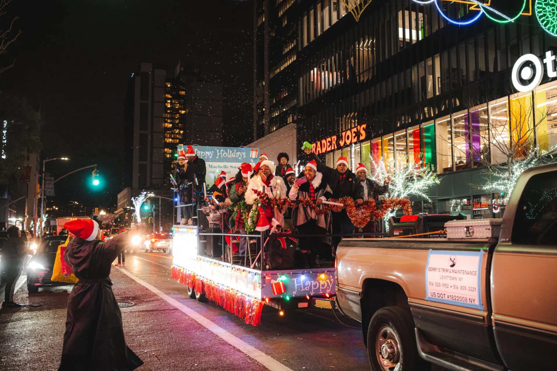 Community members enjoying the festivities at the Harlem Holiday Lights Parade. Photo credit: Brandon Vallejo