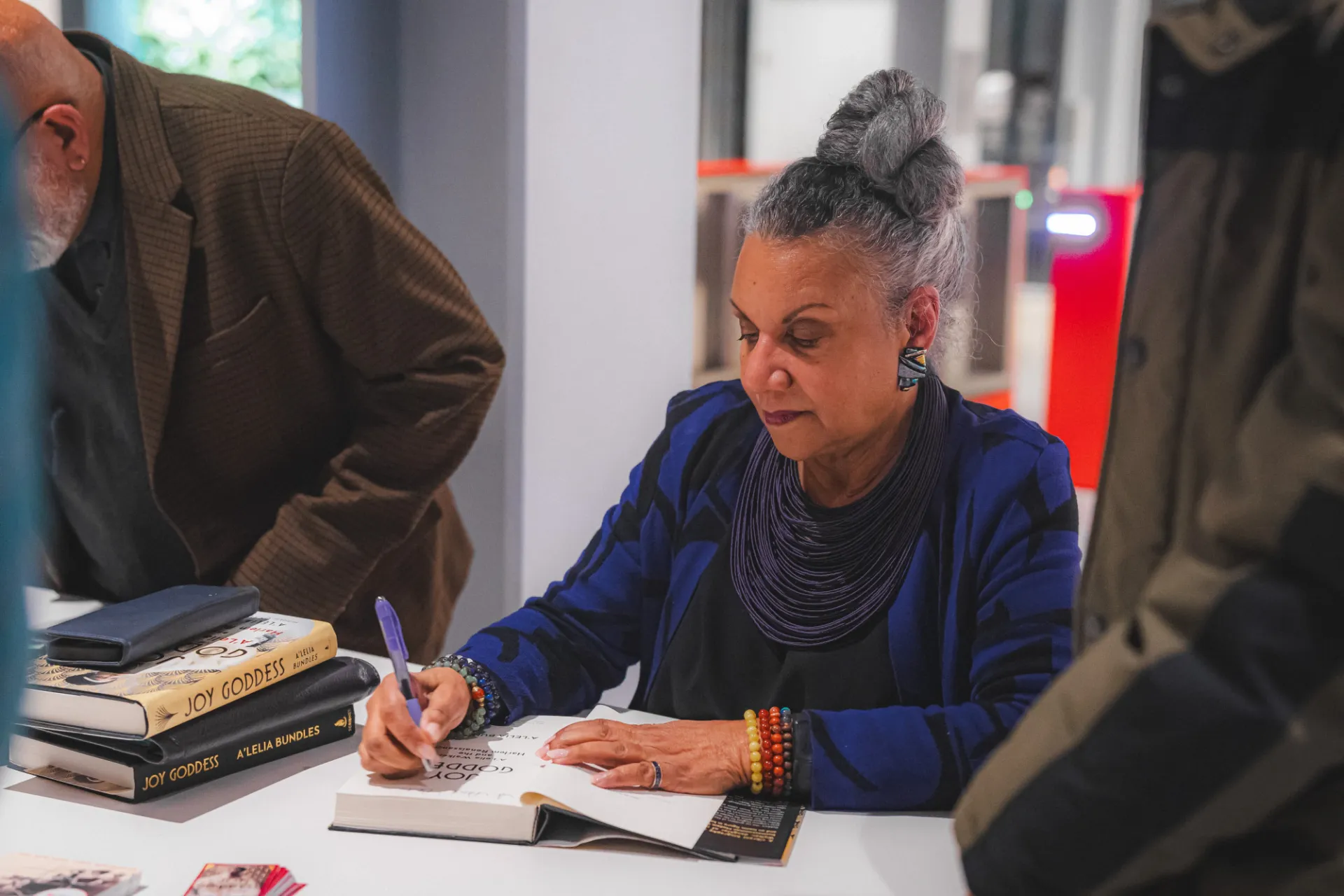 A'Lelia Bundles signed copies of the book for event attendees inside the Lee C. Bollinger Forum. Photo by: Brandon Vallejo