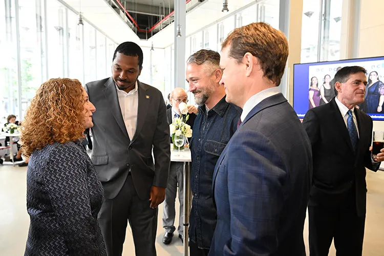Columbia University President Jennifer L. Mnookin converses with  Eli Northrup, public defender and candidate for New York State Assembly District 69, and Jordan J.G. Wright, New York state assemblymember, alongside Loftin Flowers, Vice President of Government and Community Affairs at Columbia. 