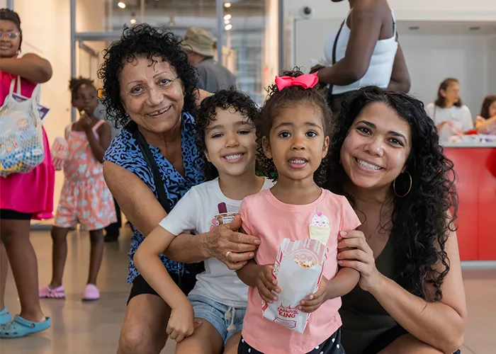 A family poses together at Manhattanville Community Day. 