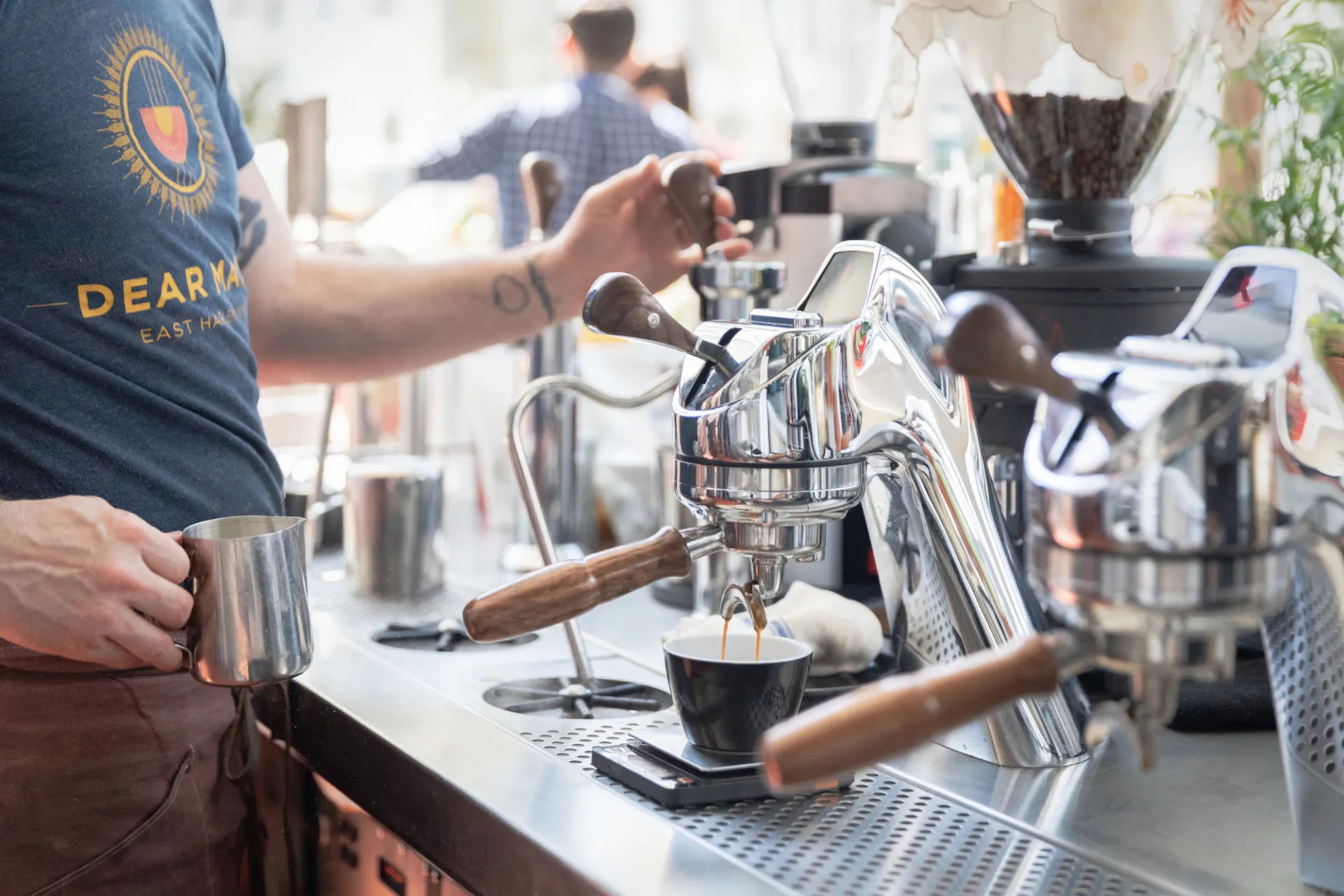A Dear Mama employee makes a cup of espresso.