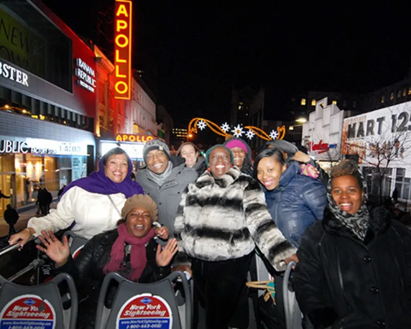 Women on a sightseeing bus smiling