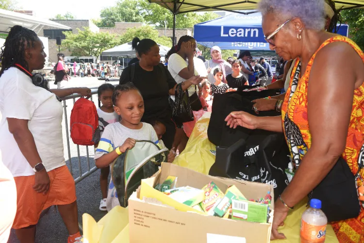 Youngsters filled their new backpacks with school supplies at the back-to-school block party. Photo credit: Susan Farley