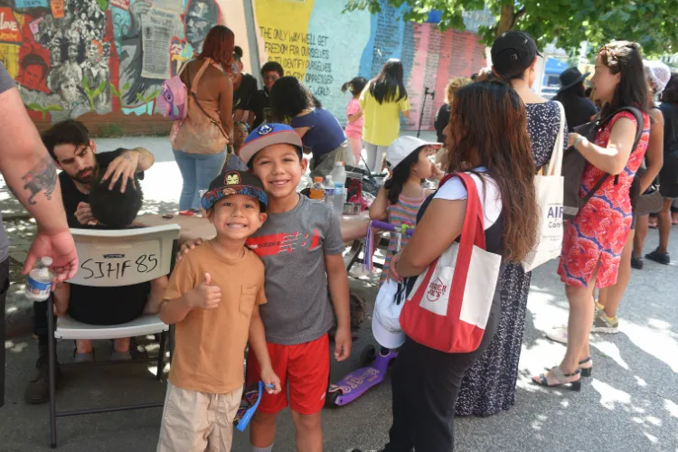 Local youth enjoyed a fun-filled afternoon of games, music, face painting, and other festivities during the annual back-to-school event in West Harlem. Photo credit: Susan Farley