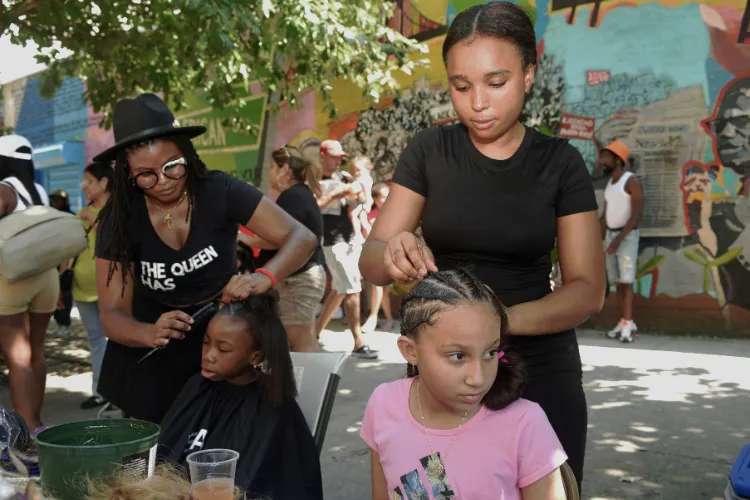 Youngsters were adorned with braided hairstyles courtesy of the Harlem-based salon, Lagazzele Hair Studio. Photo credit: Susan Farley