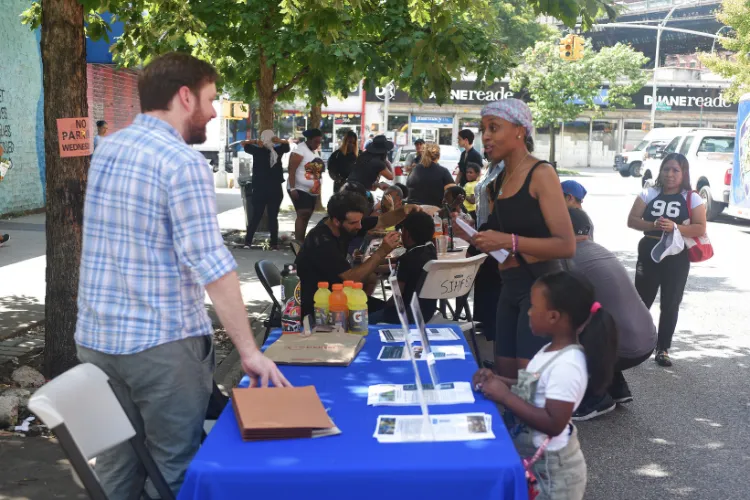 Local families learned about Columbia's community-focused programs at the annual back-to-school event in West Harlem. Photo credit: Susan Farley