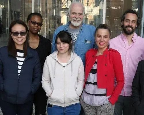 Adults posing for a photo