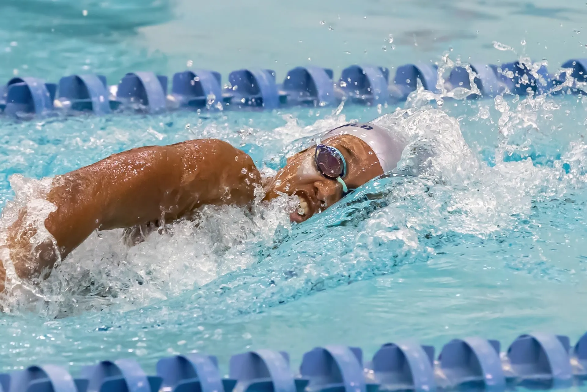 Emily MacDonald swimming competitively. Photo Credit: Columbia Athletics