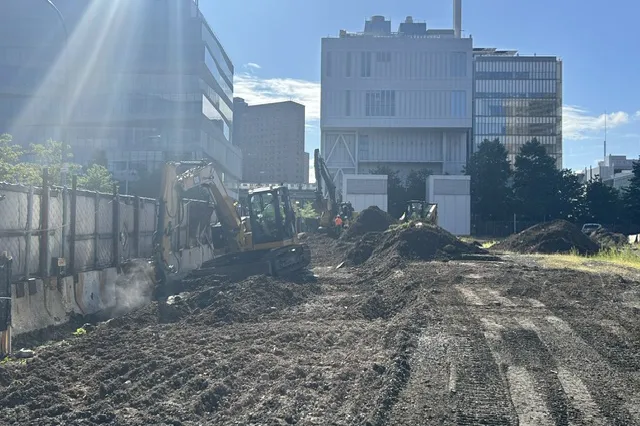 Soil being remediated by construction equipment, with Lenfest Center for the Arts, Columbia Business School, and Jerome L. Greene Science Center in the background.
