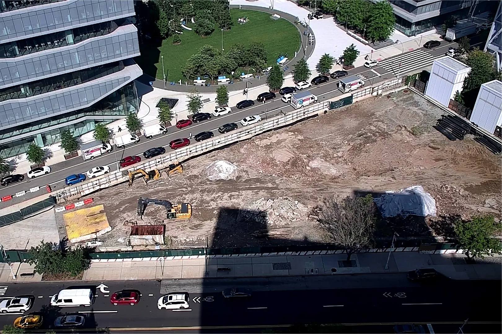 An aerial view of Site 4, which is covered with dirt, with Columbia Business School and The Square north.