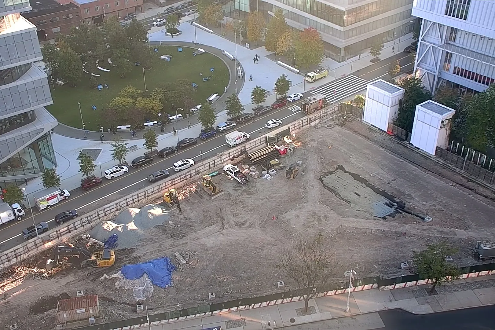 An aerial view of Site 4, which is covered with dirt, with Columbia Business School and The Square north. 