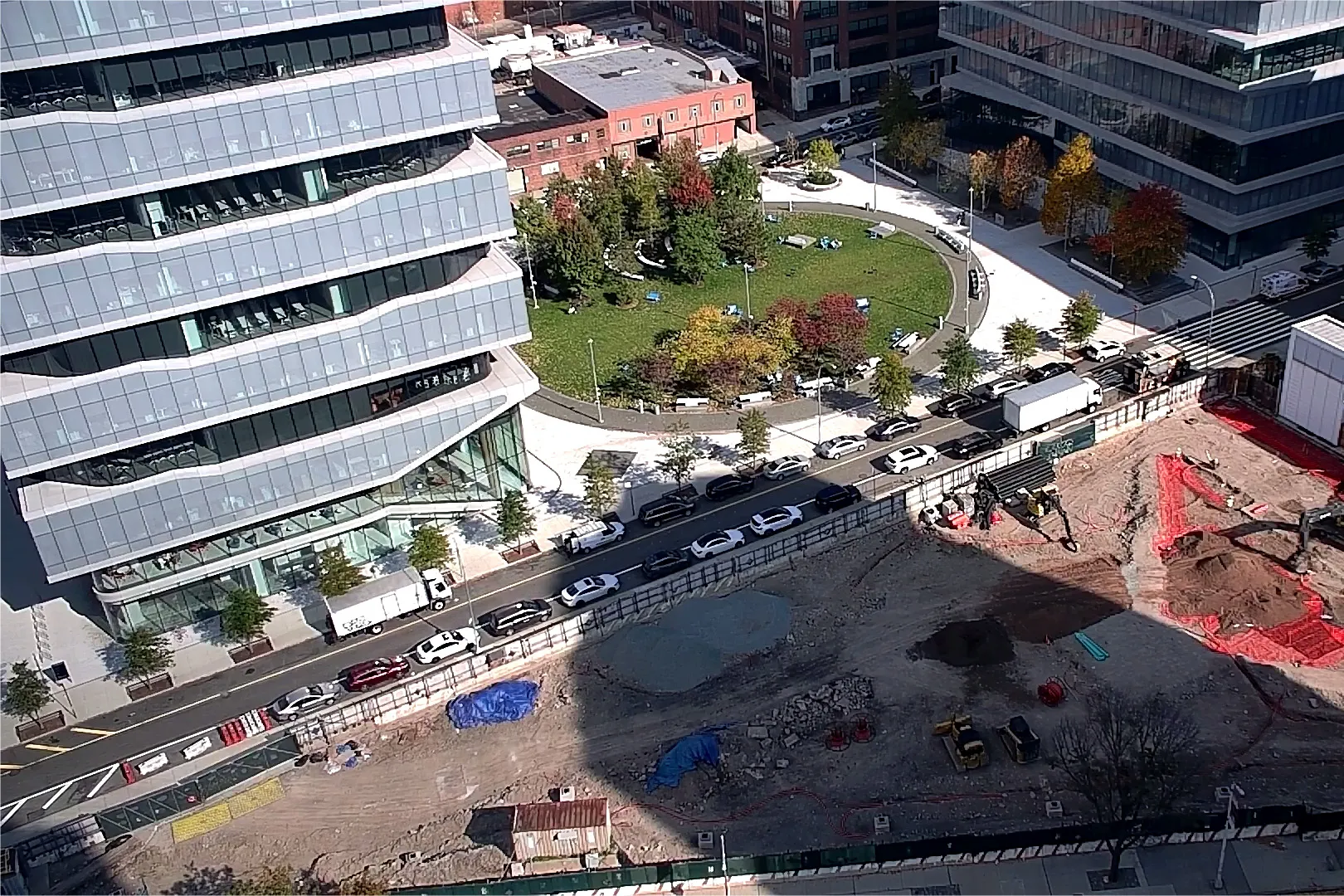 An aerial view of Site 4, which is covered with dirt, with Columbia Business School and The Square north. 