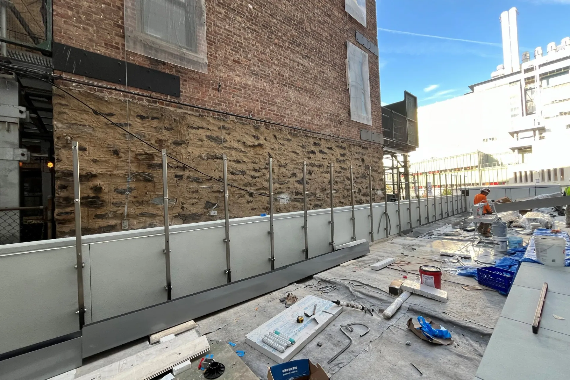 A terrace that is under construction at 600 W. 125th Street, with The Forum in the background.