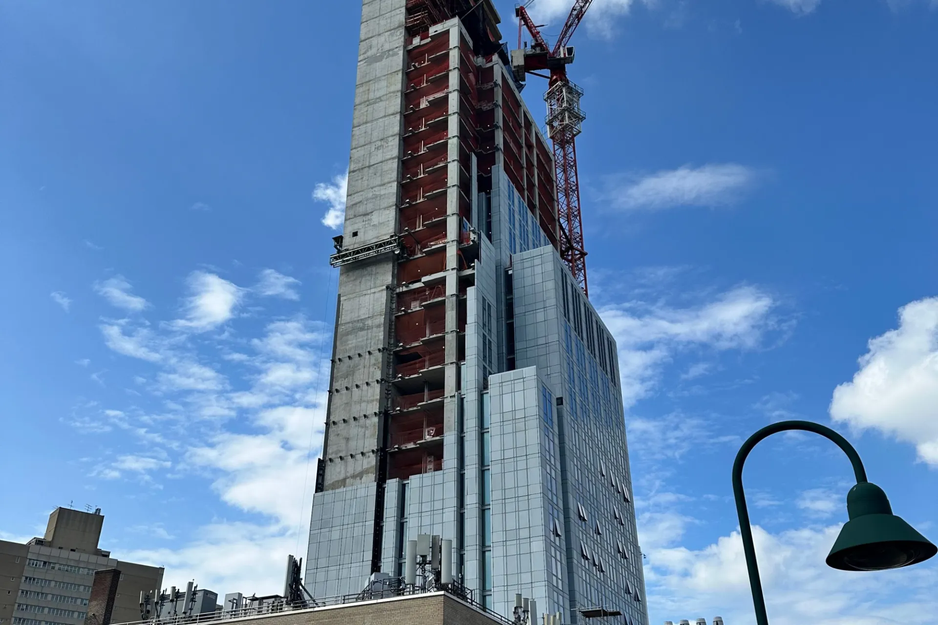 A view of the 600 W. 125th Street construction site which is 35 floors high, and has facade panels installed around it. 