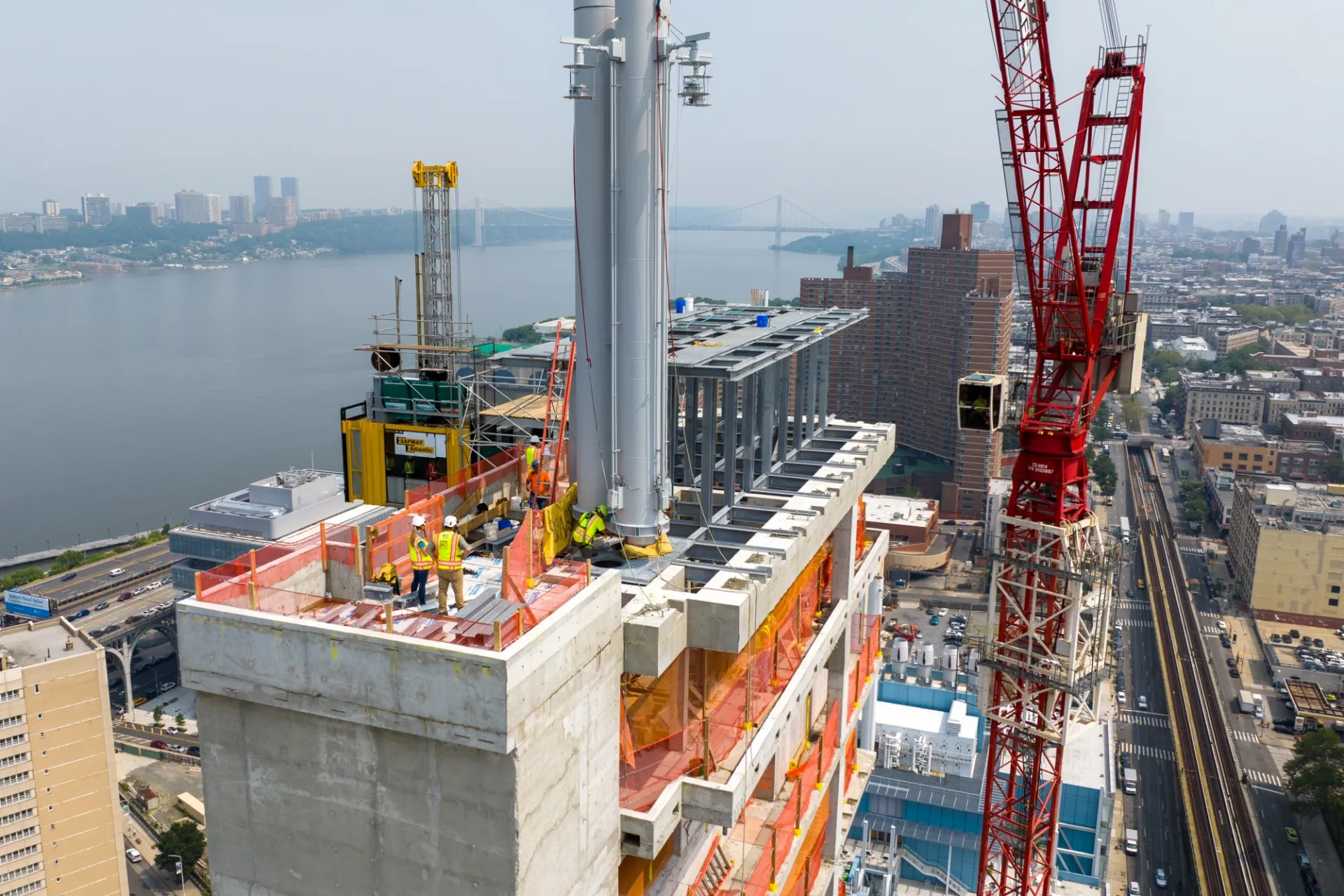An aerial view of the roof of 600 W. 125th Street, which has a large exhaust pipe on top.
