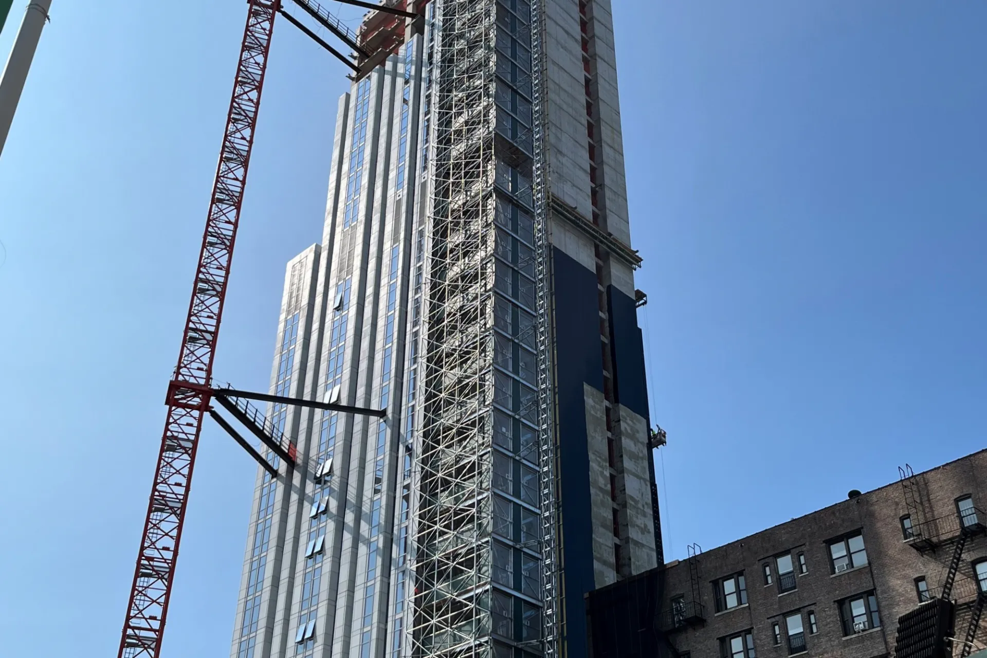 A view of the 600 W. 125th Street construction site which is 35 floors high, and has facade panels installed around it. 