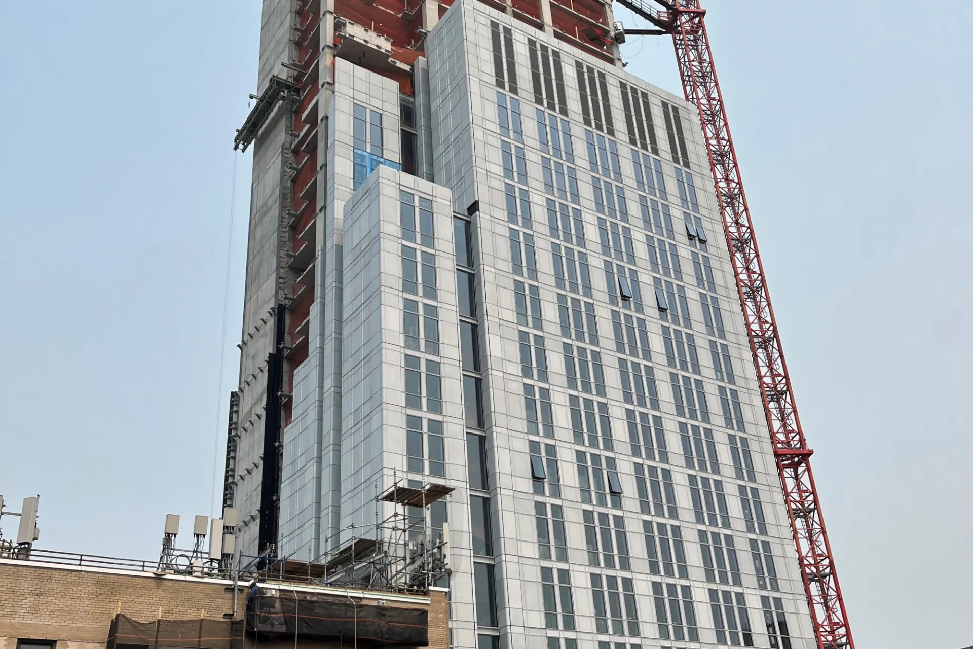 A view of the 600 W. 125th Street construction site which is 35 floors high, and has facade panels installed around it. 