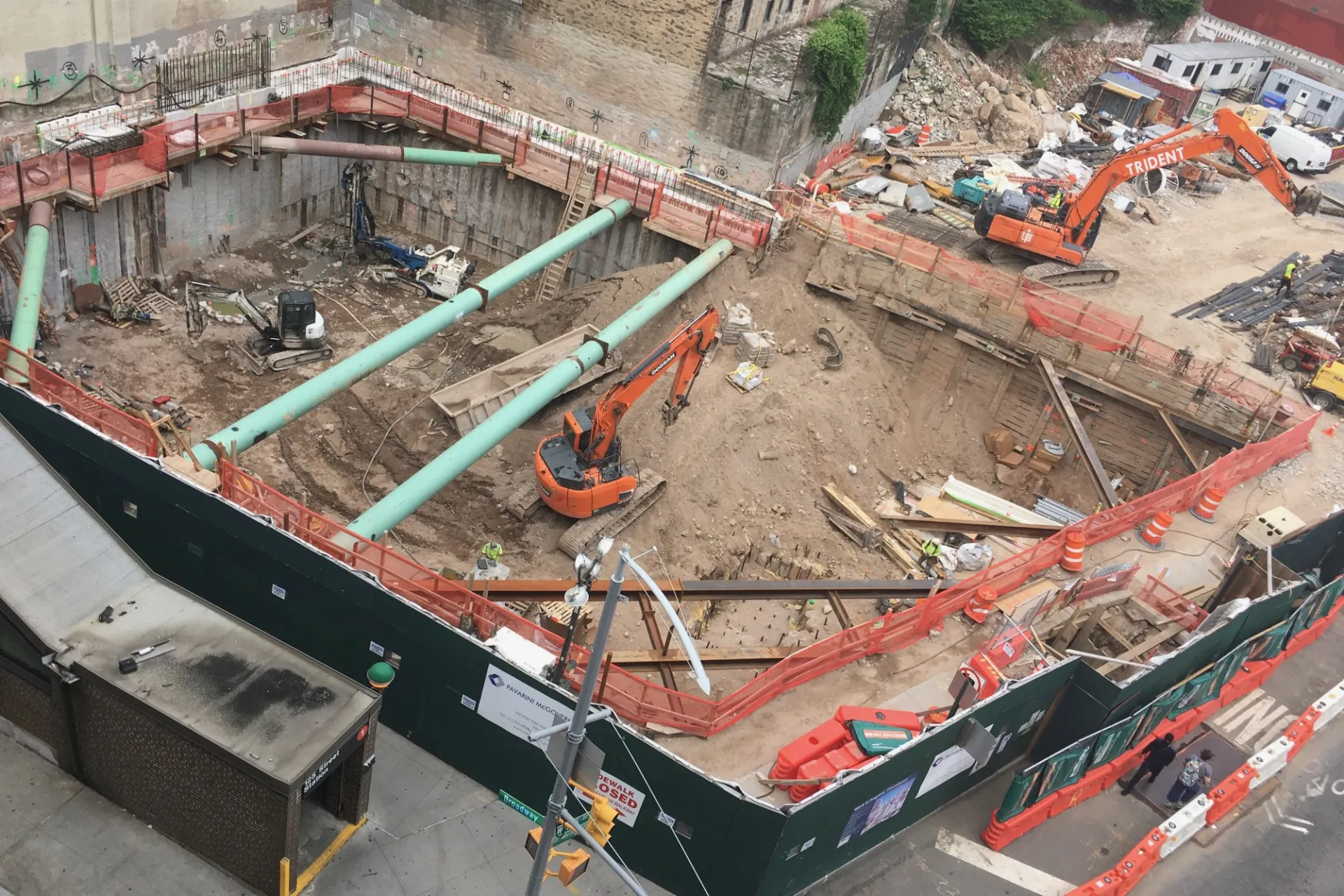 A view of the 600 W. 125th Street construction site with equipment and support pipes running across. Foundation work being performed on a construction site.  