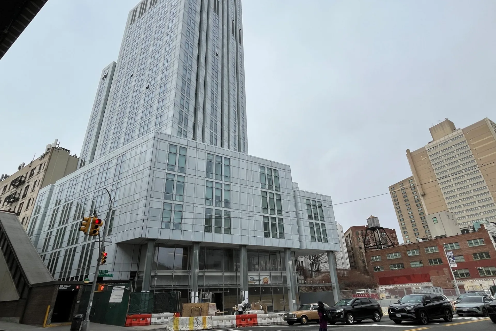 A view of the lower floors of 600 W. 125th Street from across the street on a cloudy day.