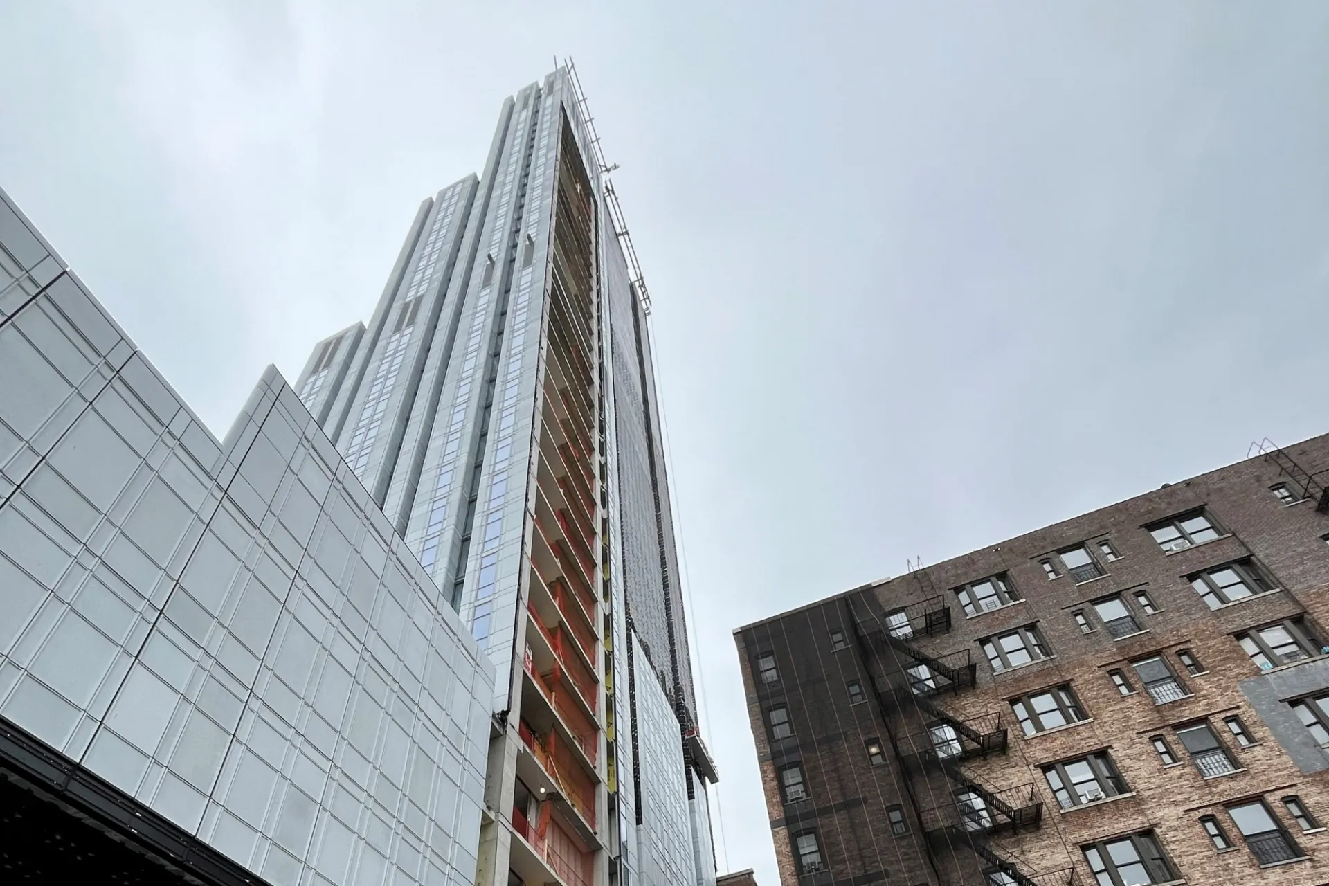 A view of the 600 W. 125th Street from the street level, looking up to the upper floors.