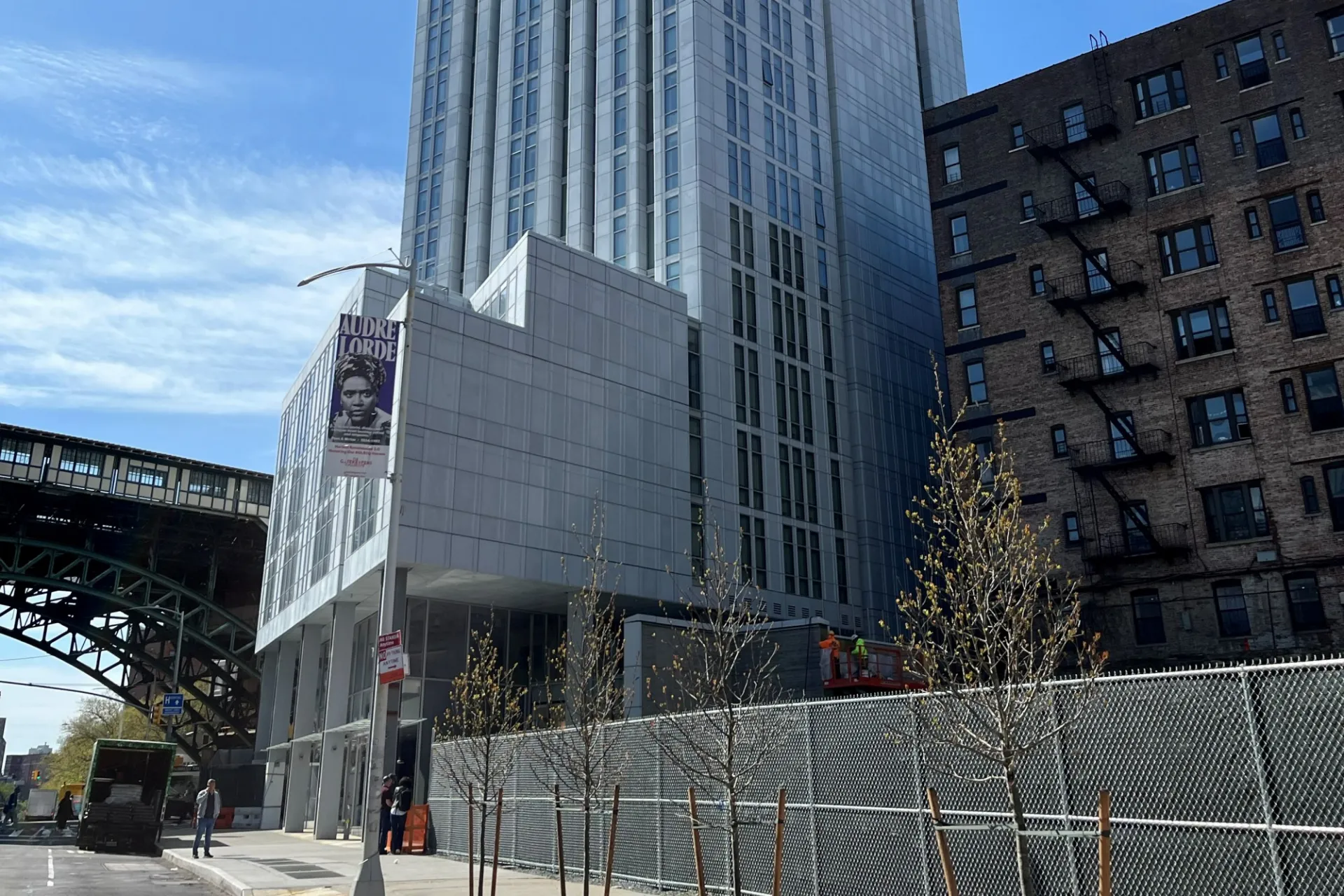 A view of the lower floors of 600 W. 125th Street with the elevated 1 train in the background. 