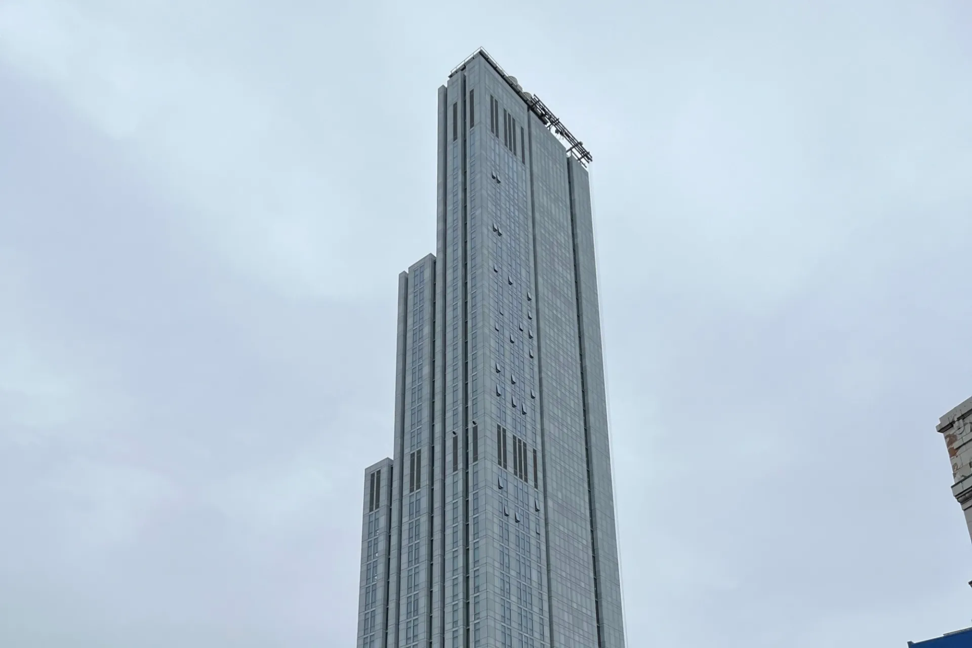 A view of the upper floors of 600 W. 125th Street, looking southeast on a cloudy day.