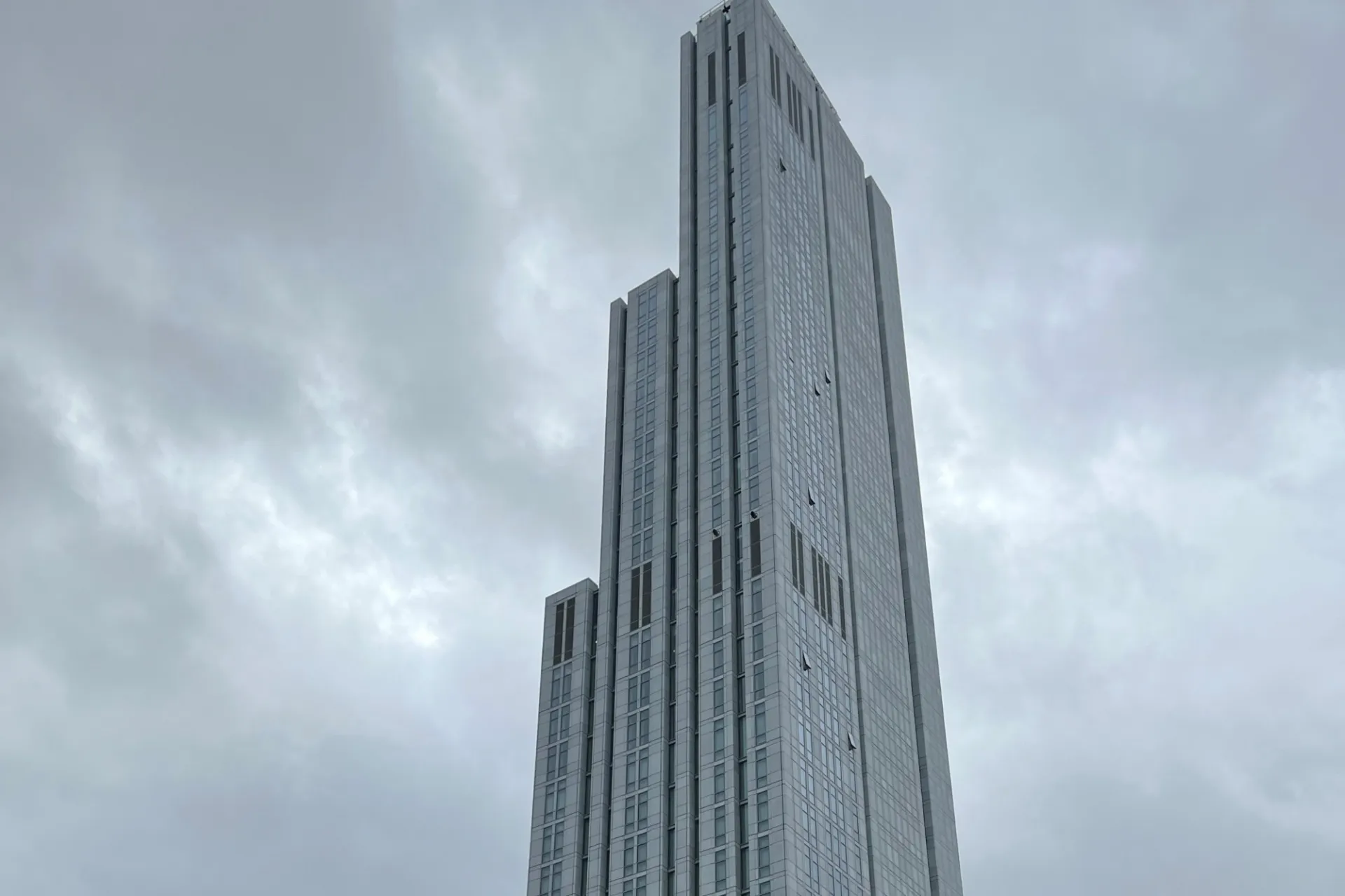 A view of the upper floors of 600 W. 125th Street on a cloudy day.