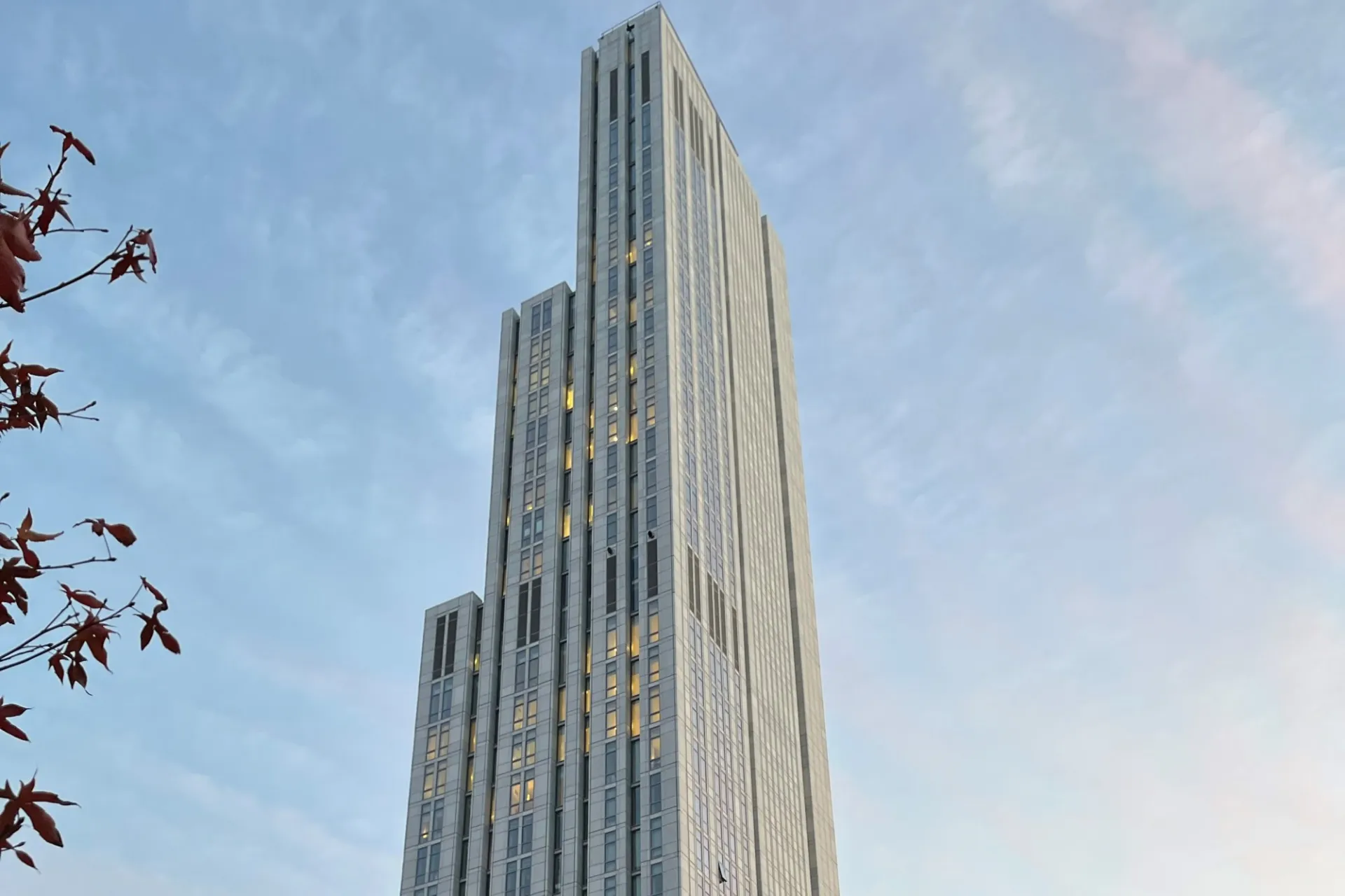 A view of the upper floors of 600 W. 125th Street during a partly cloudy day.