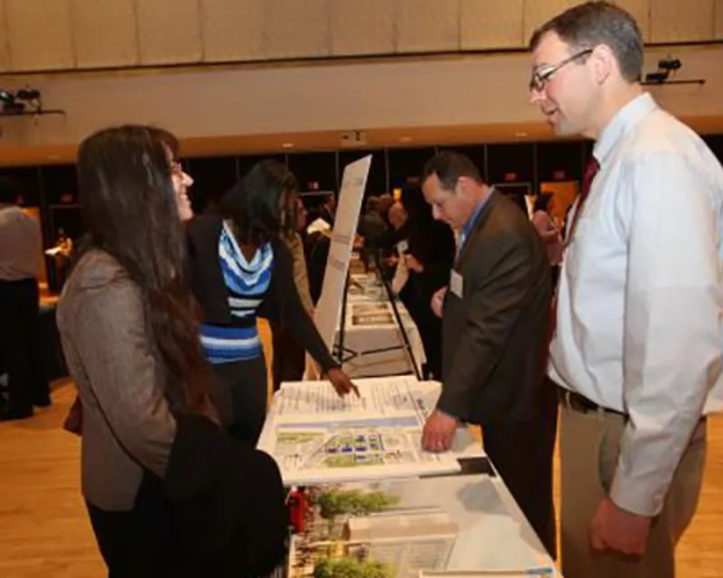  Attendees and Representatives from the Business resource Expo speaking.