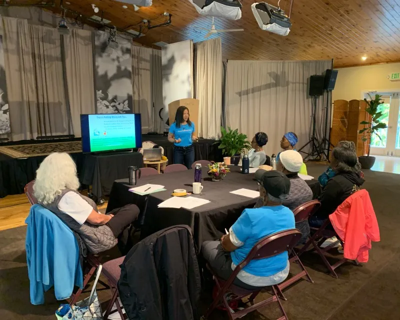 Harlem Wellness Center participants seated at conference to learn about healthy eating habits