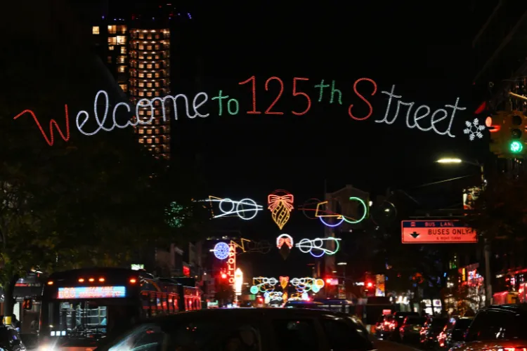 Harlem’s central corridor adorned with lights. Photo credit: Eileen Barroso