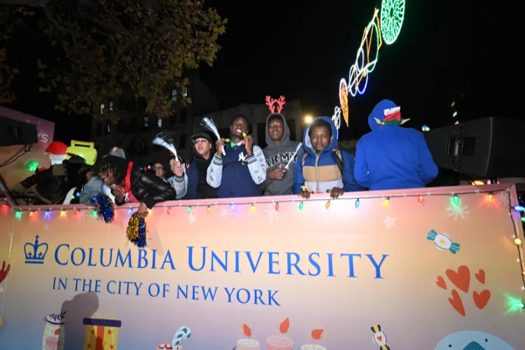 Local youth enjoying the festivities at the Harlem Holiday Lights Parade. Photo credit: Eileen Barroso