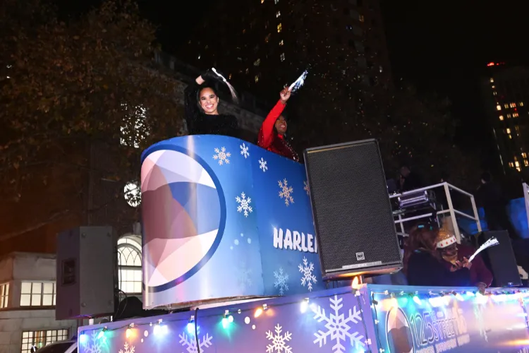 Harlem Holiday Lights Parade Grand Marshal Misty Copeland making her way across 125th Street. Photo credit: Eileen Barroso