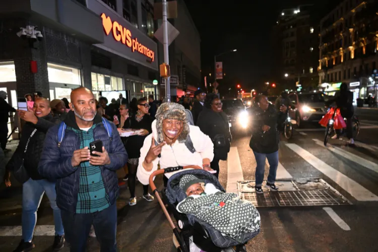 Attendees enjoying the Harlem Holiday Lights Parade. Photo credit: Eileen Barroso