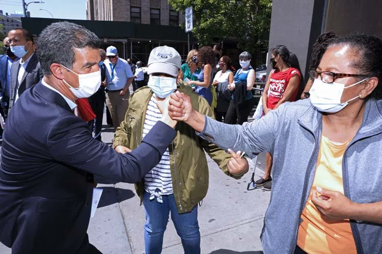 Man fist bumping woman