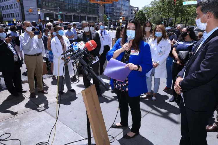 woman speaking at podium