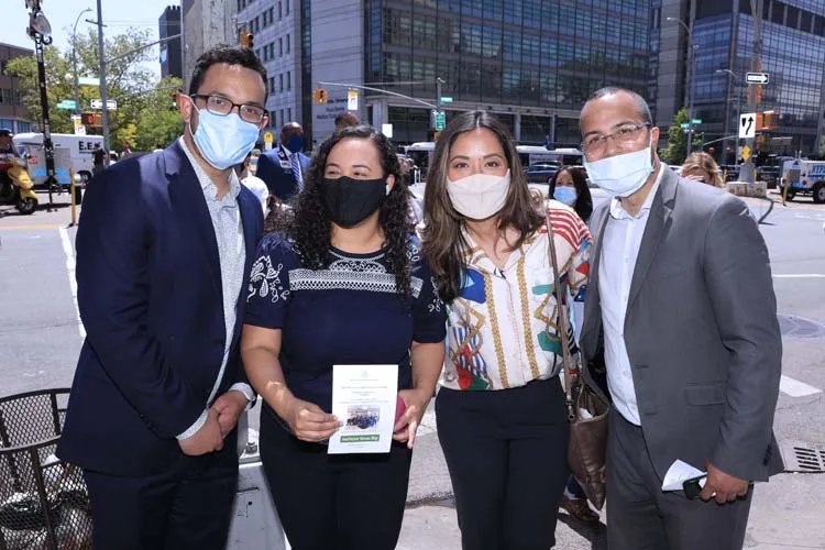 4 people standing for group photo