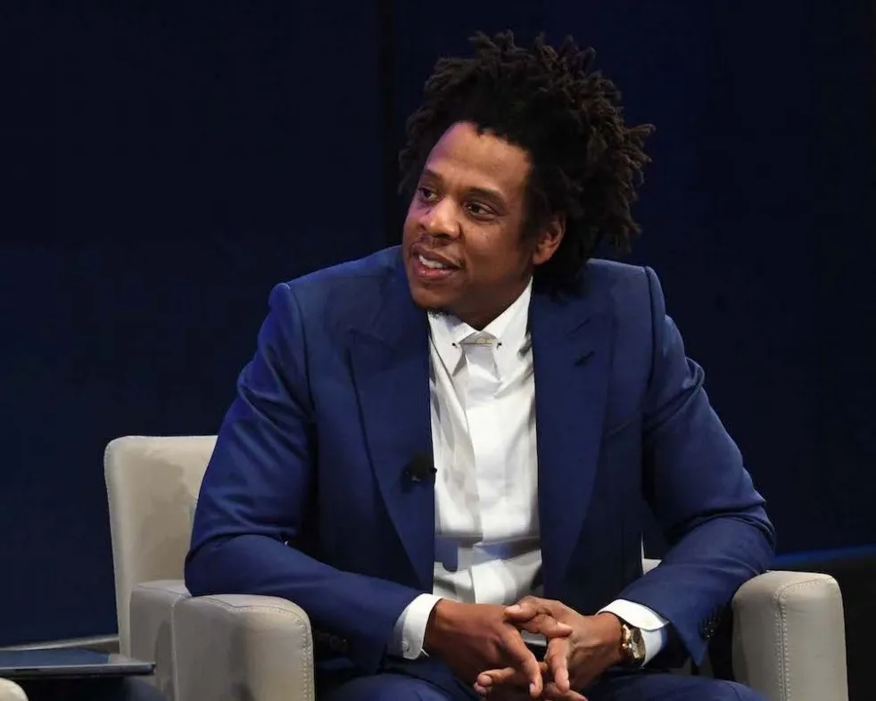 Jay-Z at The Forum, in a blue jacket and white shirt.
