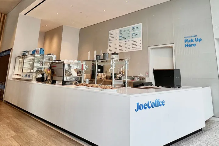 Joe Coffee inside Geffen Hall, with displays of pastries and coffee equipment on the counter.