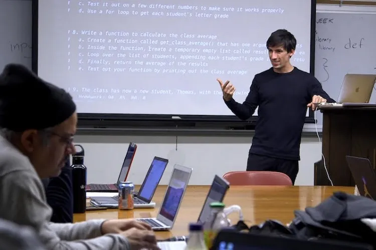 Justice Through Code instructor, Mattan Griffel, with students in class, in February 2020, before the global pandemic curtailed in-person instruction.