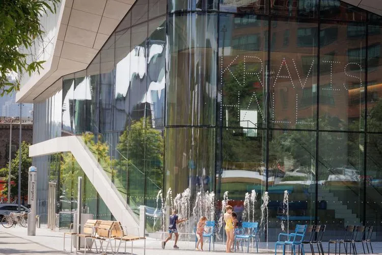 Children play at the entrance of Columbia Business School's Kravis Hall on the Manhattanville Campus. 
