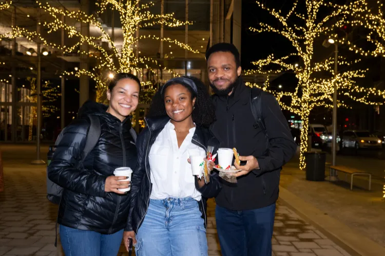 Attendees mixed and mingled over cups of hot cocoa at the Lights on the Plaza celebration. Photo credit: Diane Bondareff